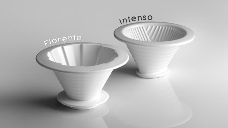 Senz V white ceramic pour-over coffee drippers labeled 'Fiorentine' and 'Intenso' on a light gray reflective surface.