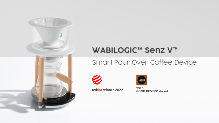 Wabilogic Senz V smart pour over coffee device with a white conical filter, clear glass carafe, and light wood legs, has been recognized with the Red Dot Design Award 2022 and the US GOOD DESIGN Award